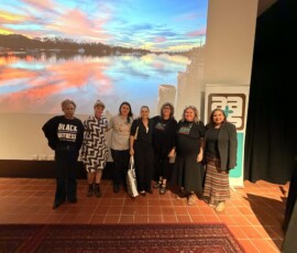 Dr Faye Rosas Blanch, Associate Professor Victoria Stead, Dr Talei Mangioni, Dr Amy McQuire, Associate Professor Natalie Harkin, Associate Professor Ali Gumillya Baker and Professor Simone Ulalka Tur at the Radford Auditorium at the Art Gallery of South Australia (2026).